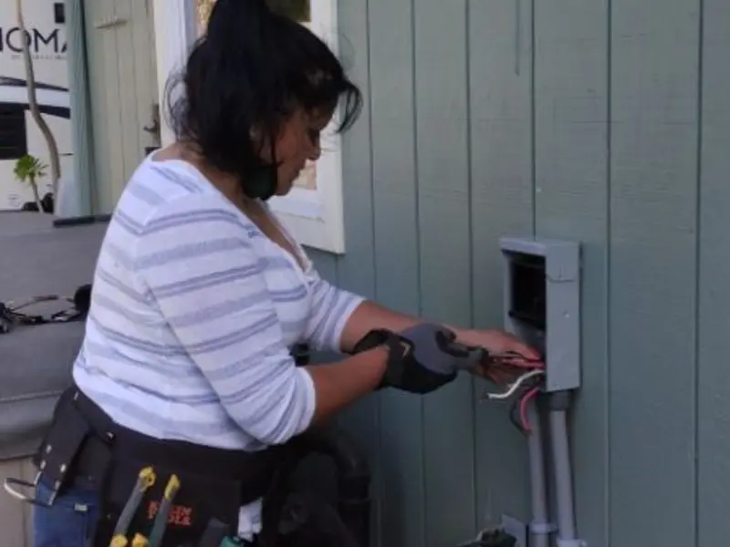 Licensed electrician wiring an exterior subpanel in Readington