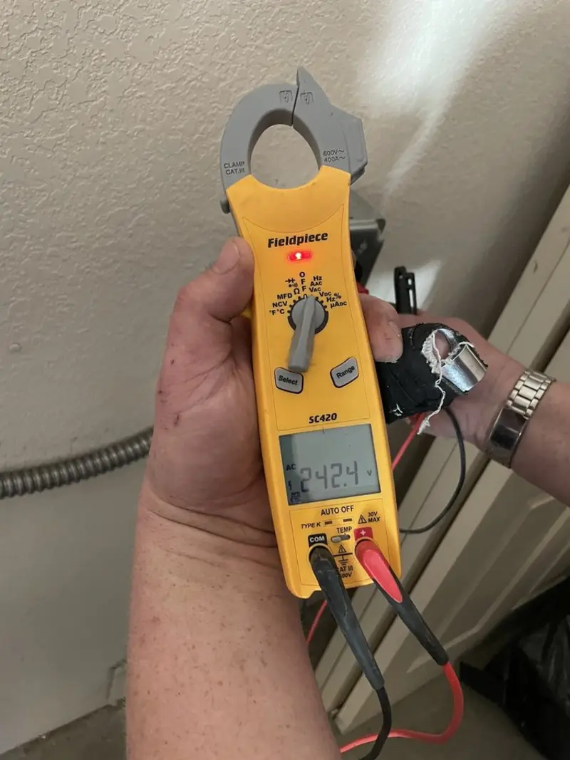 Voltage testing with clamp meter during Recessed Lighting Installation in Readington